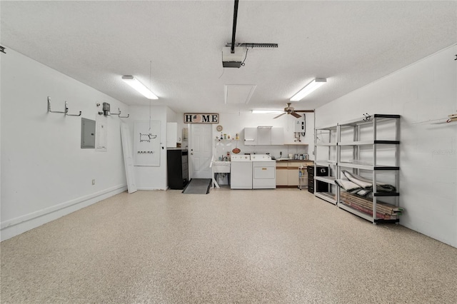 garage with electric panel, a garage door opener, separate washer and dryer, and sink