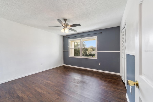 unfurnished room with dark hardwood / wood-style floors, a textured ceiling, and ceiling fan