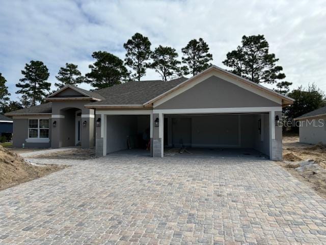 single story home with a garage