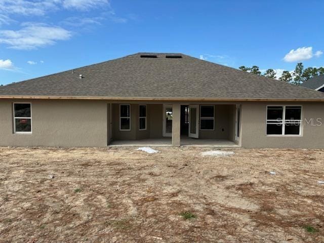 back of property featuring a patio