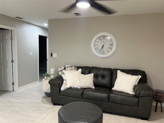 living room featuring ceiling fan and light wood-type flooring