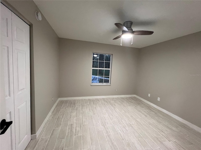 unfurnished room featuring ceiling fan and light hardwood / wood-style flooring