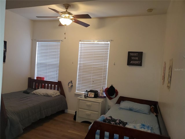 bedroom with ceiling fan and hardwood / wood-style floors