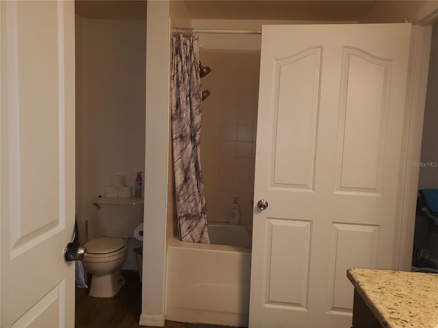 full bathroom with shower / tub combo, vanity, hardwood / wood-style flooring, and toilet