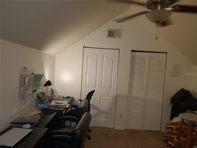 carpeted office space with ceiling fan and vaulted ceiling