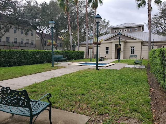 view of home's community featuring a lawn