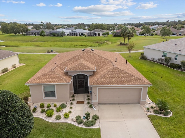 view of front facade featuring a garage and a front yard