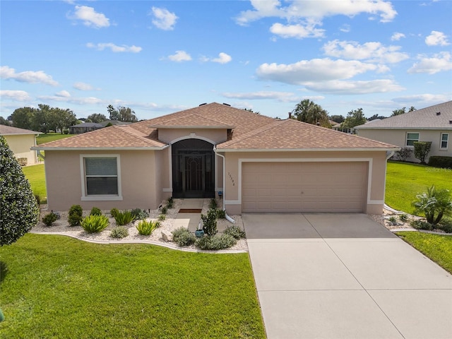 ranch-style home with a garage and a front yard