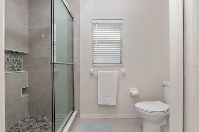 15596 SW 13th Cir, Ocala, FL 34473 - full bathroom with tile patterned flooring, tiled shower, toilet, and baseboards