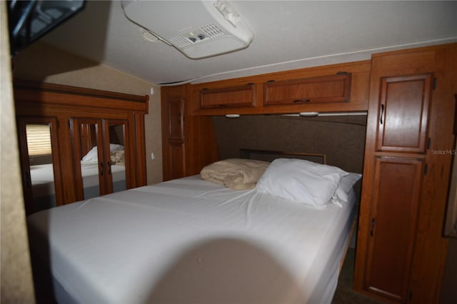 bedroom with lofted ceiling