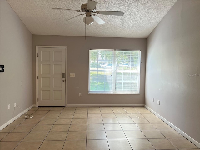 interior space featuring ceiling fan and a textured ceiling