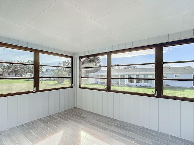 unfurnished sunroom featuring plenty of natural light