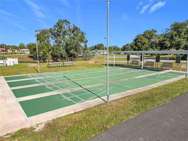 view of property's community with a lawn