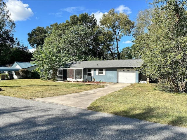 view of front of house with a garage and a front yard