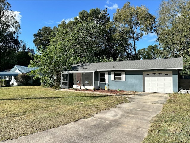 ranch-style home featuring a garage and a front lawn