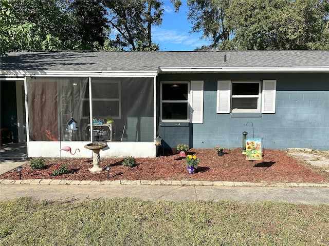 view of front of house with a sunroom