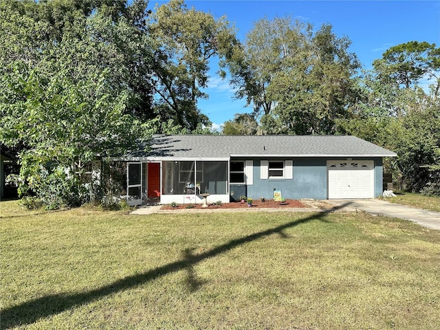 single story home with a garage and a front yard