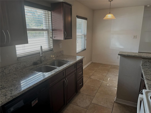 kitchen featuring sink, dishwasher, dark brown cabinets, light stone countertops, and decorative light fixtures