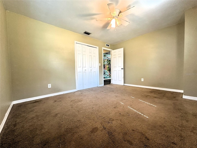 unfurnished bedroom with ceiling fan, a closet, and carpet