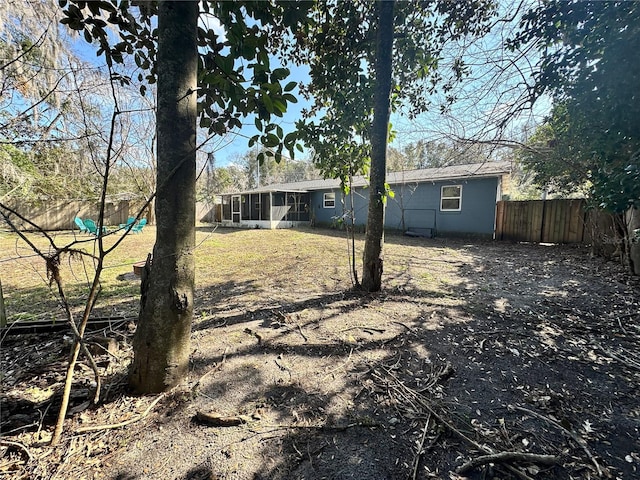 view of yard with a sunroom