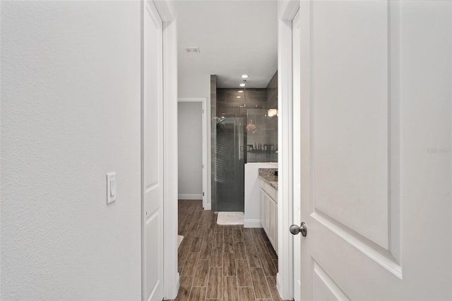 hallway featuring dark hardwood / wood-style flooring