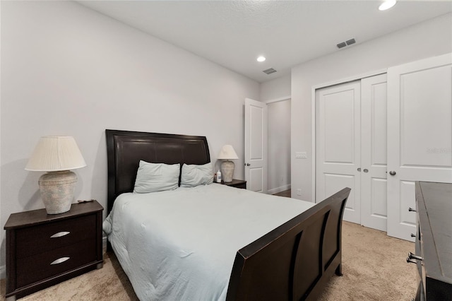 carpeted bedroom with a closet