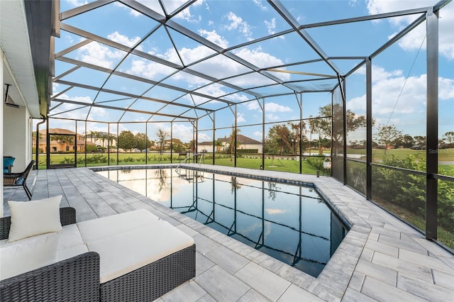 view of pool with a lanai, a yard, and a patio area