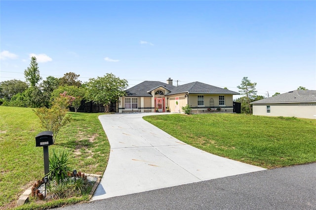 ranch-style house with a garage and a front lawn