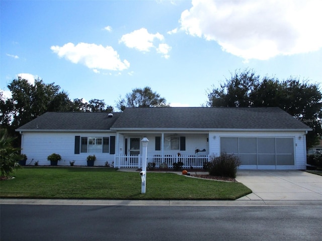 ranch-style house with a garage, a front yard, and covered porch