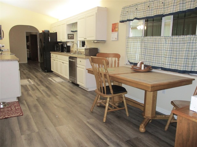 dining room featuring hardwood / wood-style flooring and sink