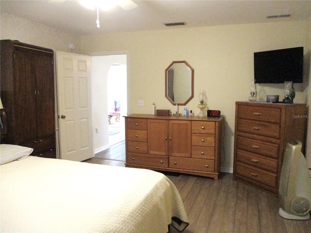 bedroom featuring dark hardwood / wood-style flooring and ceiling fan