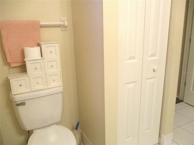 bathroom with tile patterned floors and toilet