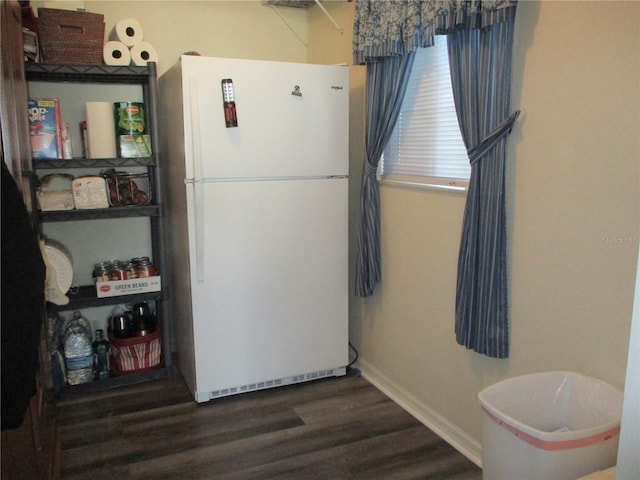 kitchen featuring dark wood-type flooring and white refrigerator