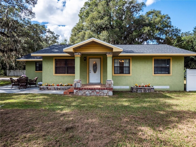 ranch-style home with a front yard