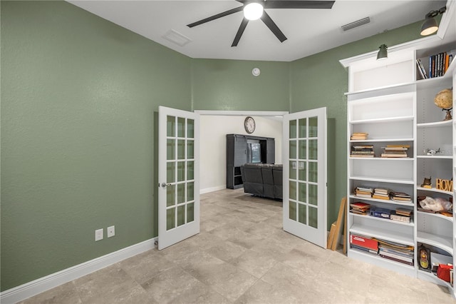 spare room with french doors and ceiling fan