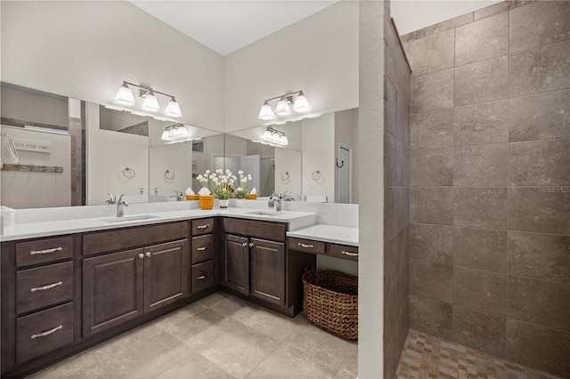 bathroom featuring vanity and a tile shower