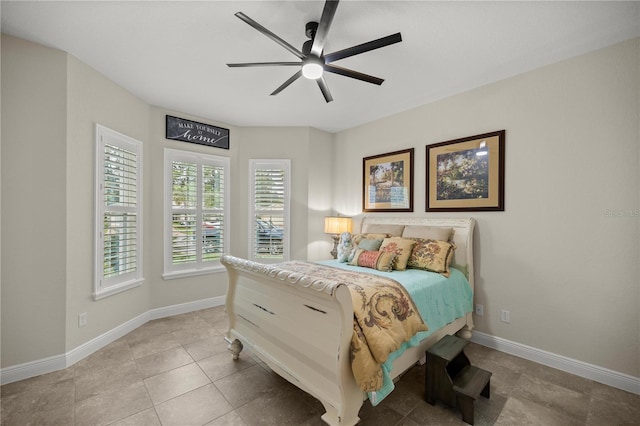 bedroom with light tile patterned floors and ceiling fan