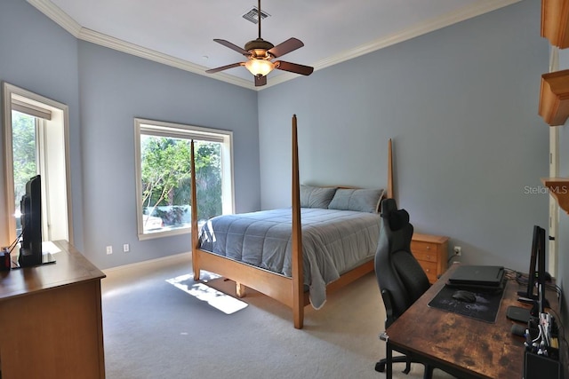 bedroom featuring light colored carpet, ceiling fan, and crown molding