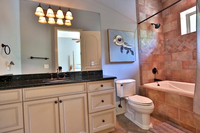 full bathroom with toilet, vanity, tiled shower / bath, and tile patterned floors