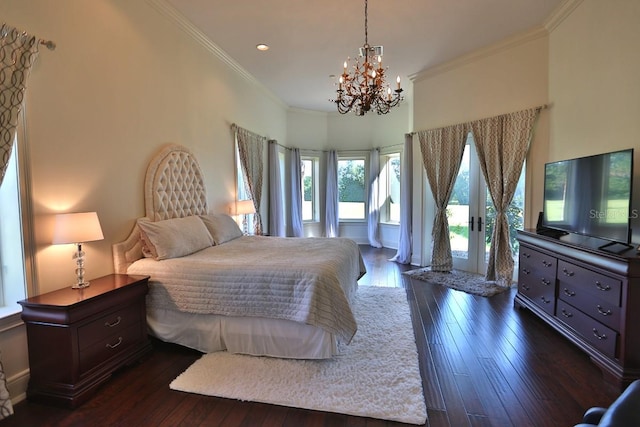 bedroom featuring ornamental molding, french doors, a notable chandelier, and dark hardwood / wood-style floors