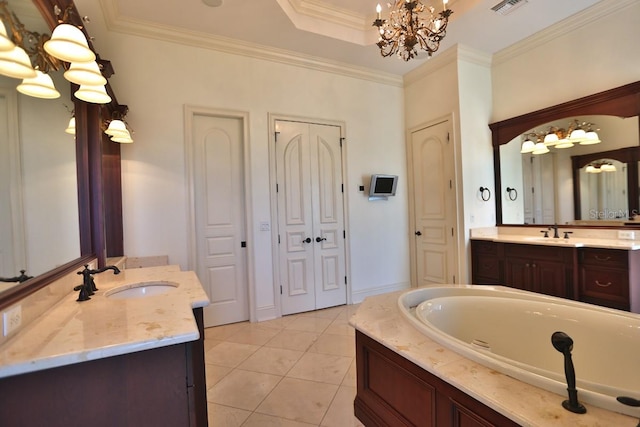 bathroom with tile patterned flooring, ornamental molding, an inviting chandelier, vanity, and a bath