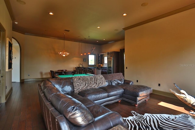 living room featuring dark wood-type flooring and ornamental molding