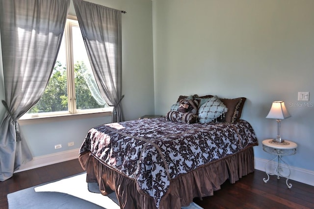 bedroom featuring dark wood-type flooring