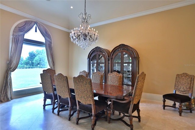 dining space with crown molding and a notable chandelier