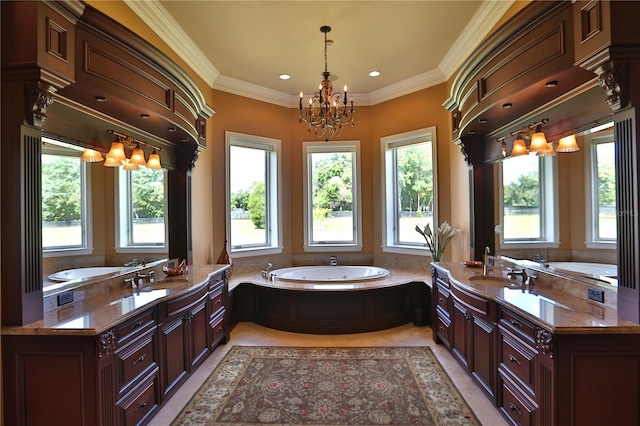 bathroom featuring ornamental molding, a washtub, vanity, and a notable chandelier