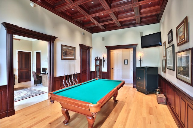 game room featuring pool table, beam ceiling, a towering ceiling, light hardwood / wood-style flooring, and coffered ceiling