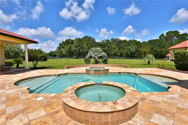 view of pool with a lawn, an in ground hot tub, and a patio area