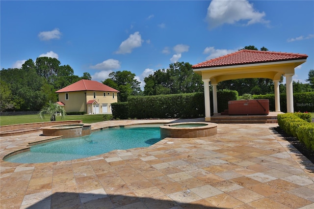 view of pool with a patio area, a gazebo, and an in ground hot tub