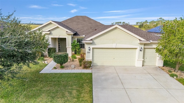 view of front of home with a garage and a front yard