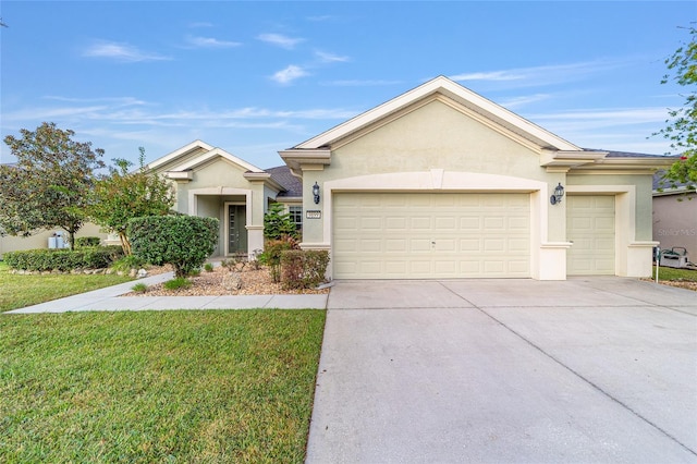 ranch-style home featuring a garage and a front lawn